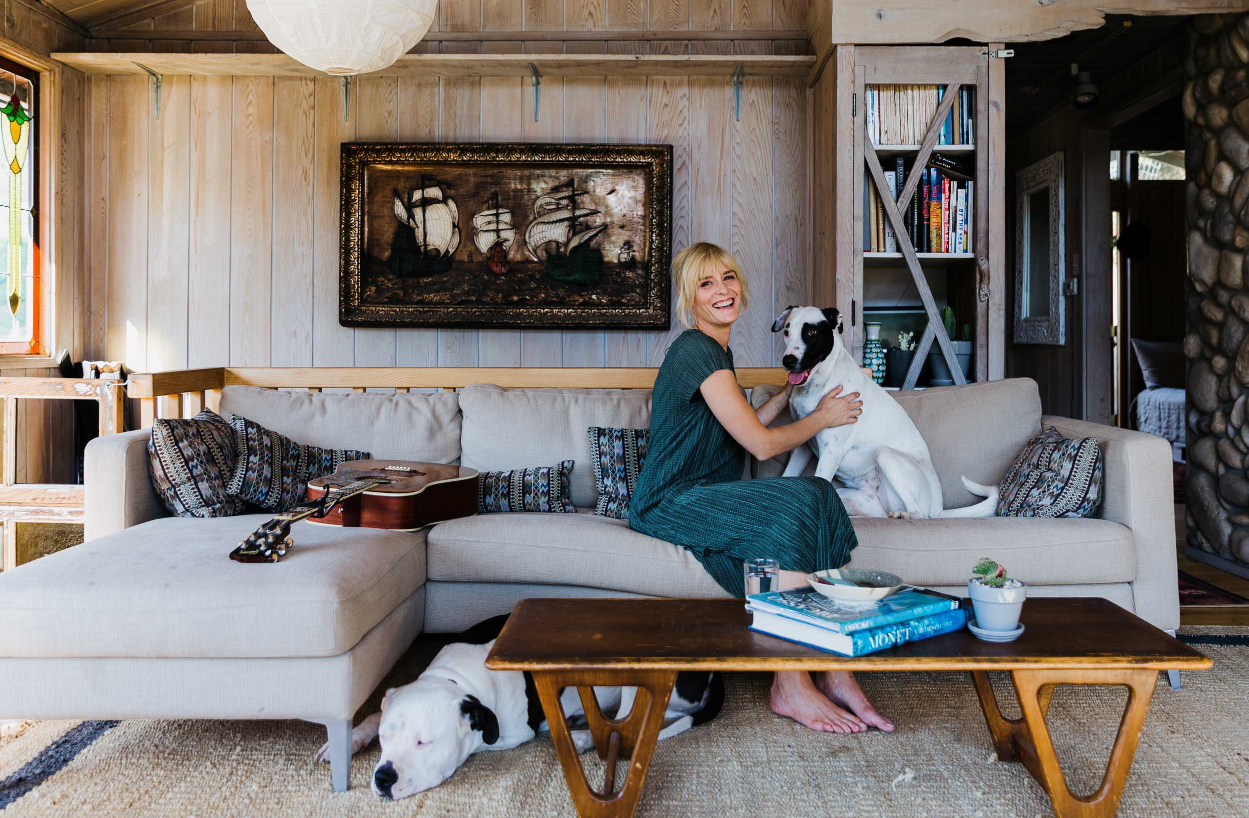 Musician Marnie Herald in her living room wiht her dog.