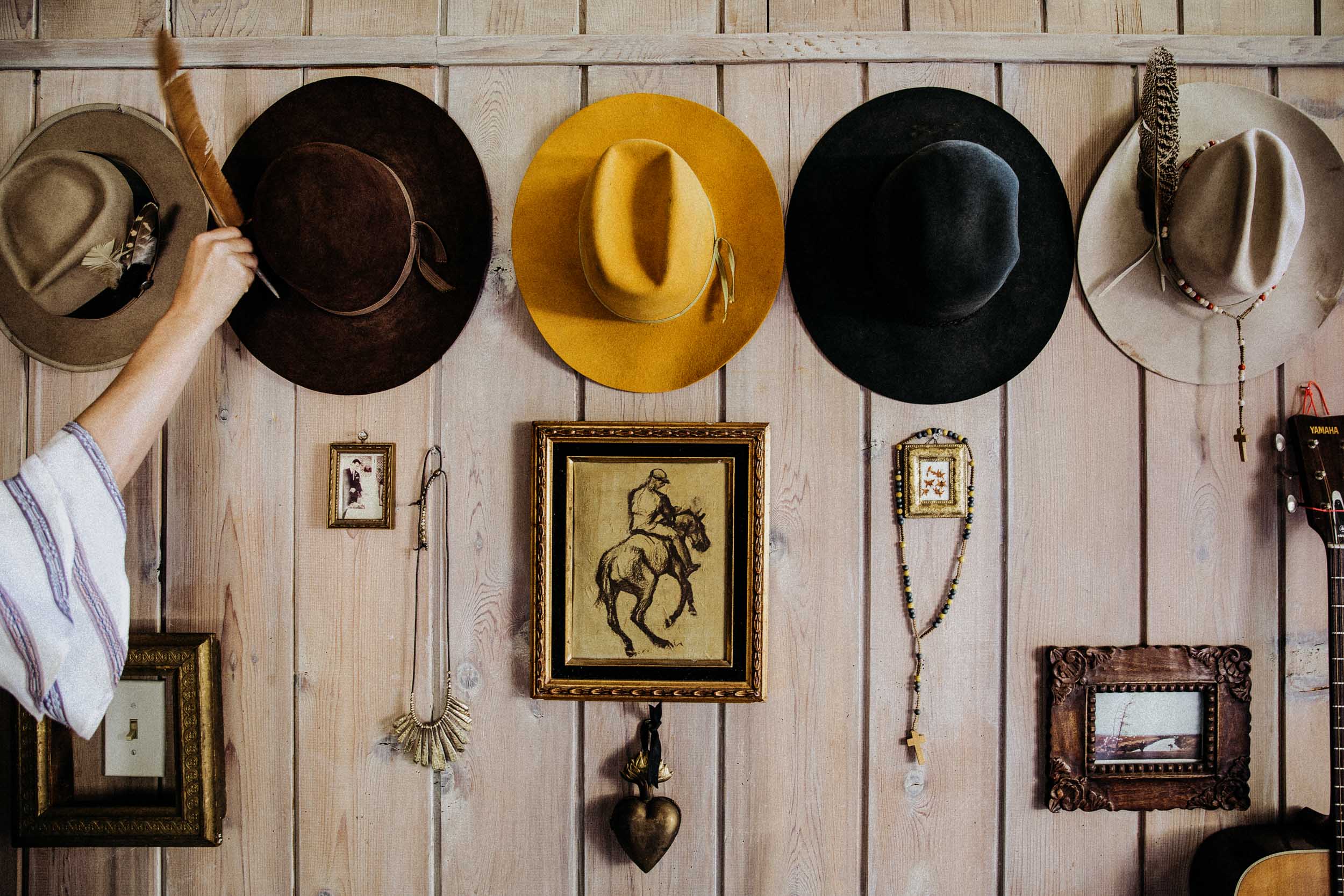 Wall of hats and art