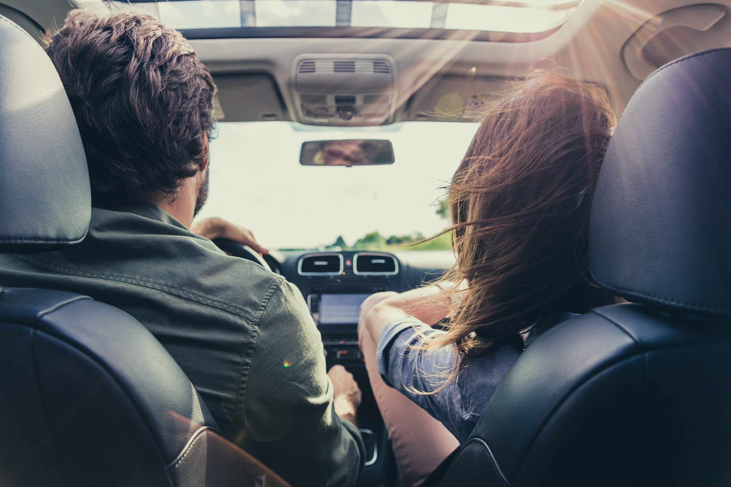 Couple driving car